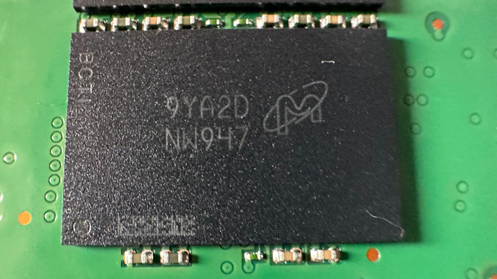Micron 512GB 64-Layer 3D QLC NAND Flash Package NW947 Macro Photography on Micron 5210 ION PCB